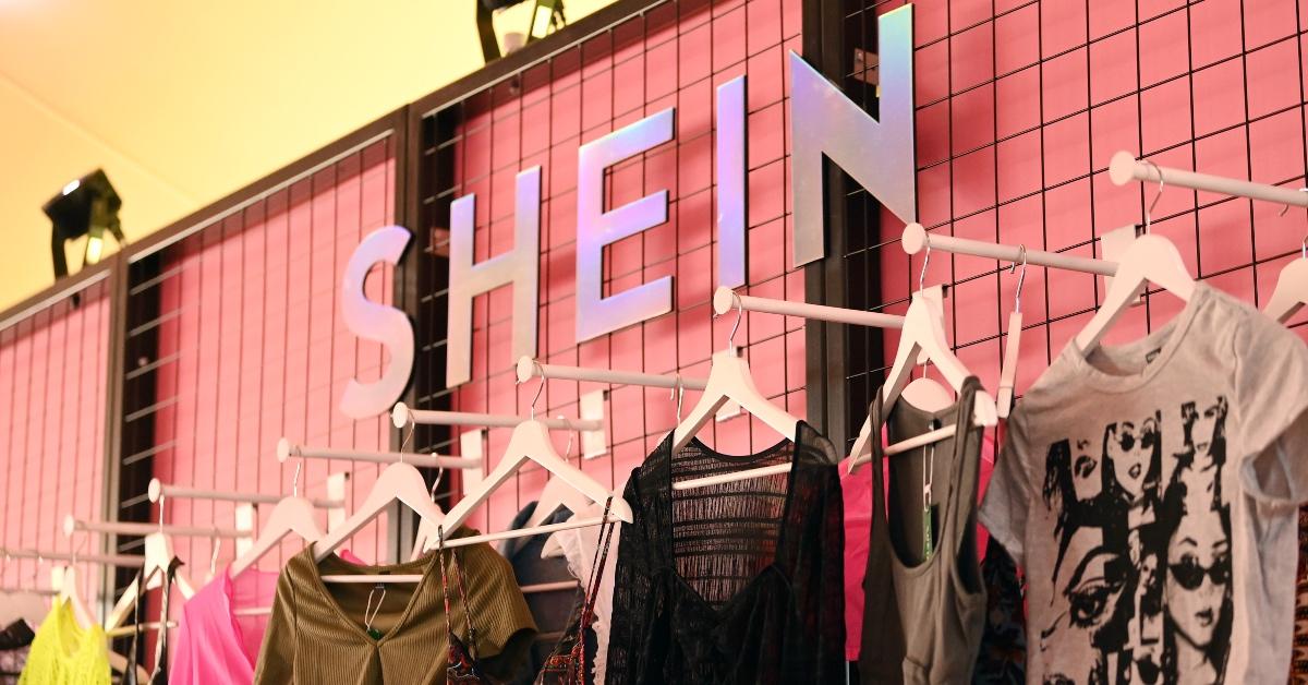 A photograph of Shein clothing on display at an influencer event. 