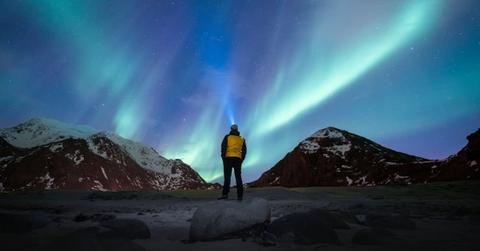 A man gazing at the Northern Lights. (Representative Cover Image Source: Getty Images | Marco Bottigelli)