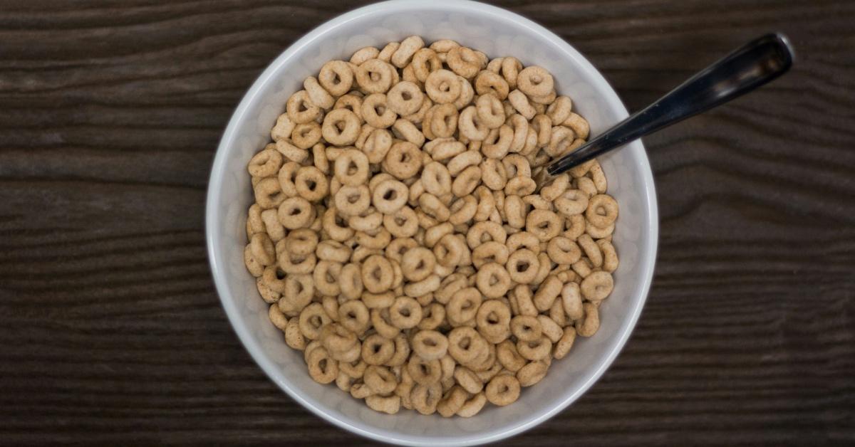 Bowl of circular cereal on a wooden table. 