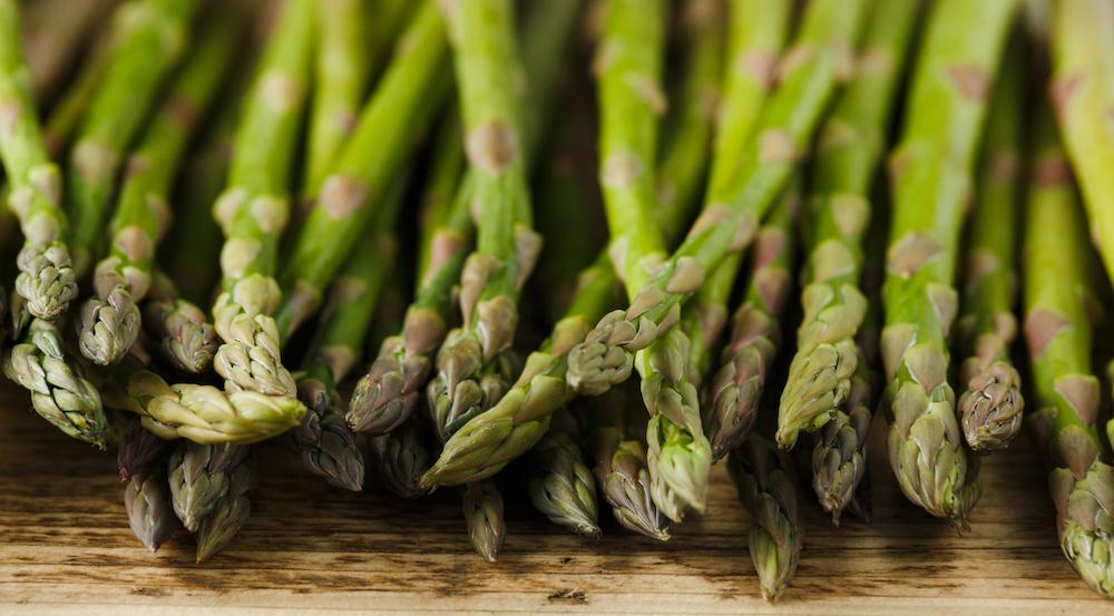 Asparagus on a wooden table.