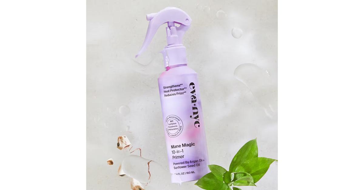 heat protectant spray in purple bottle with plants