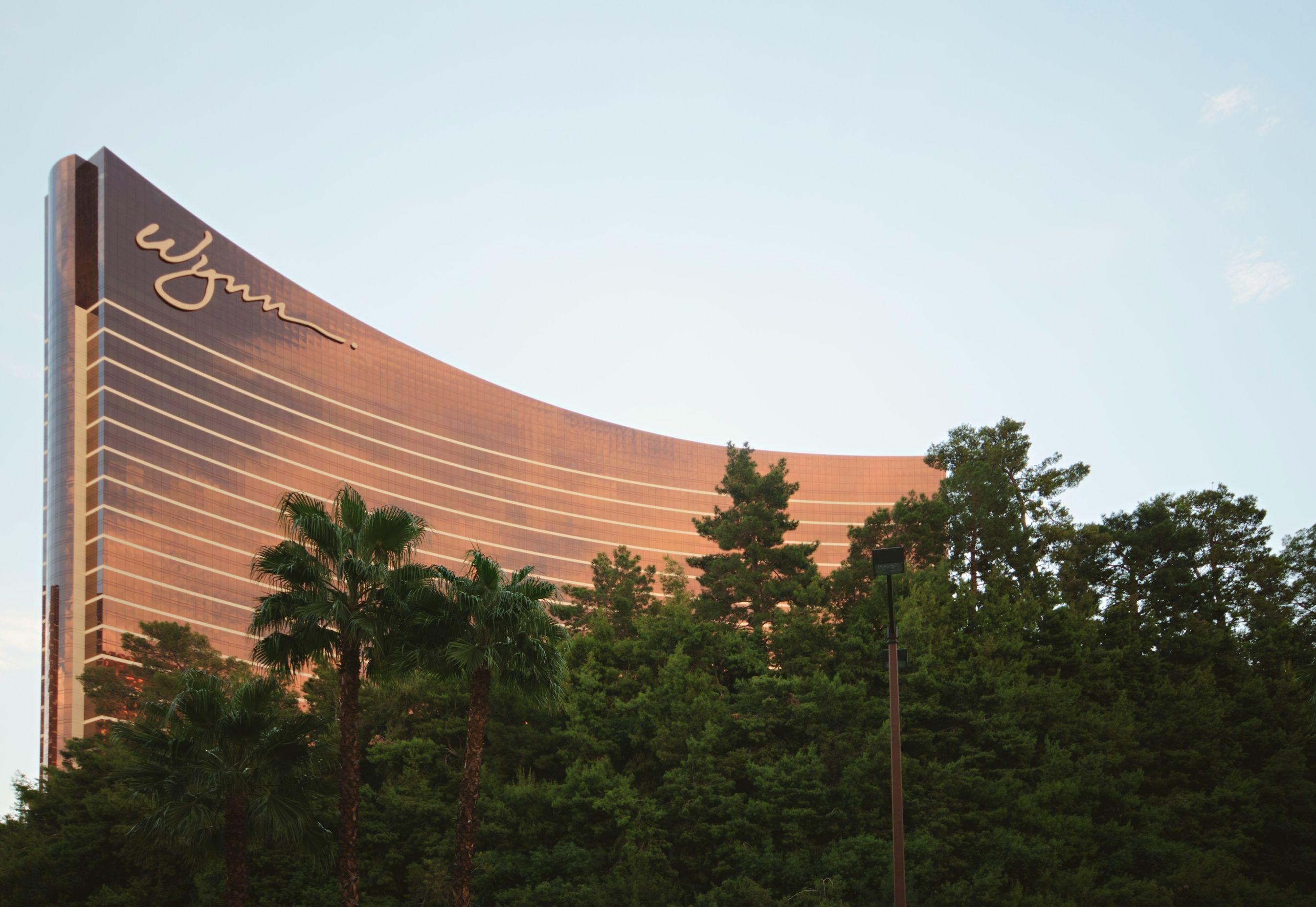The Wynn Las Vegas building is pictured behind a collection of trees.