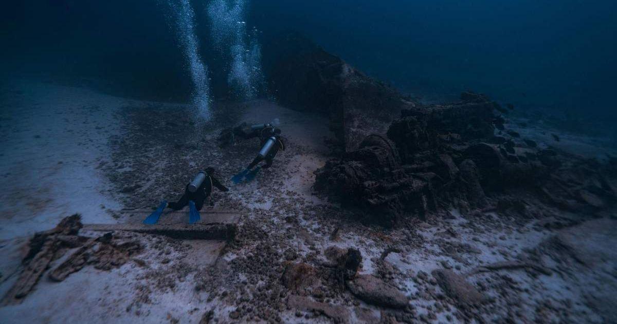 Diver exploring rocky structures deep beneath the ocean. (Representative Cover Image Source: Pexels | Harvey Clements)