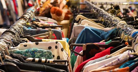 Close up of a clothing rack in a thrift store