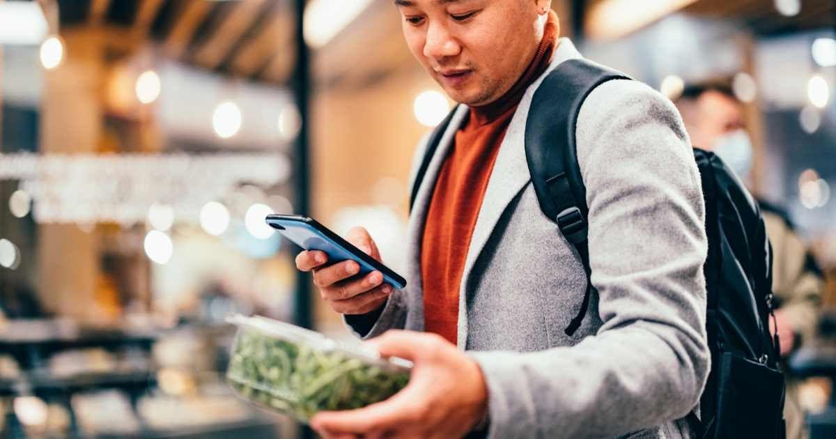 A man is inspecting a box of salad in the grocery store. (Representative Cover Image Source: Getty Images | Miniseries)
