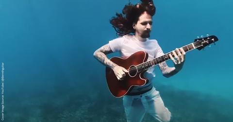 Passionate guitarist 'Bernth' plays his song 'Farewell' while submerged in the Caribbean Sea. (Cover Image Source: YouTube | @Bernthguitar)