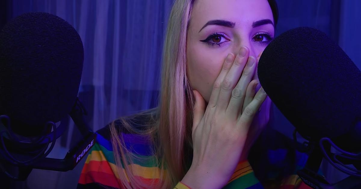 ASMR YouTube creator Gibi ASMR whispers into a black microphone 