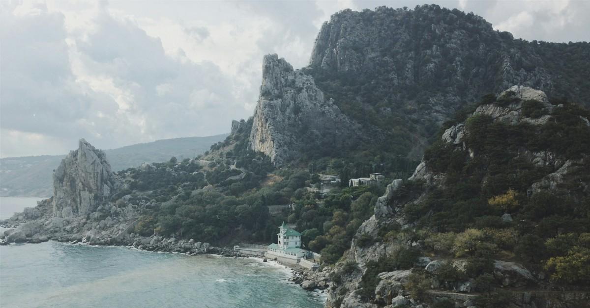 A house sits on the coast of the Black Sea, where an oil spill dumped 4,000 tons of fuel after a storm