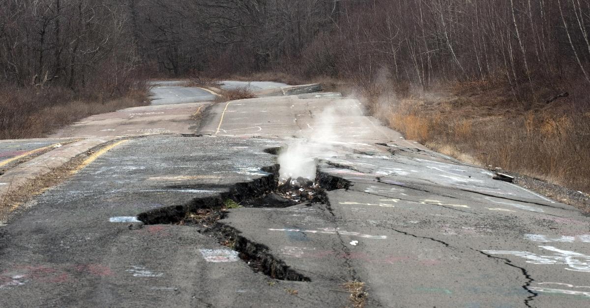 Smoke from an underground mine fire billows from an abandoned road in Centralia, PA.