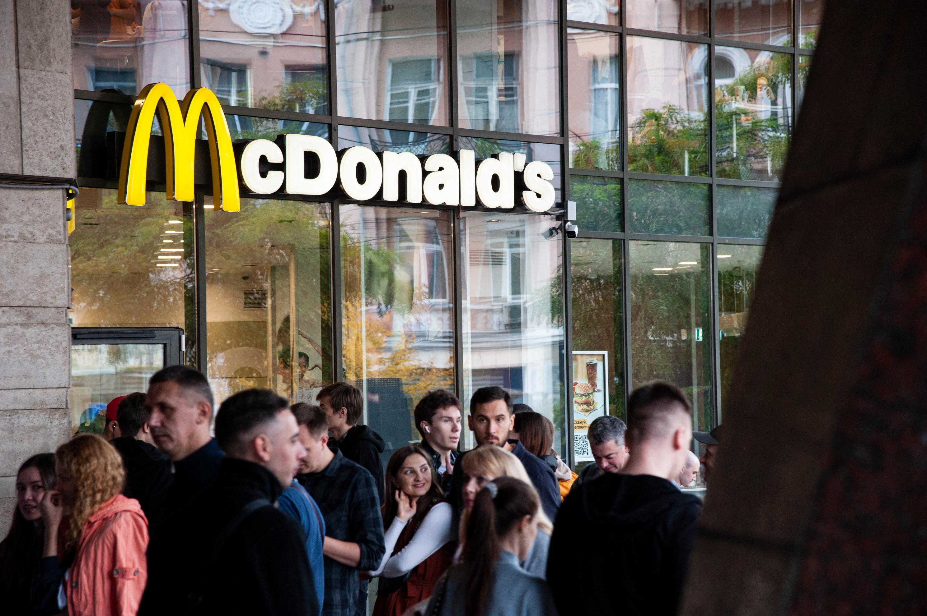 Customers line up outside a McDonald's store.