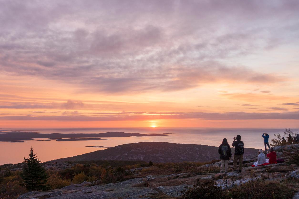 People watching the sunrise at Cadillac Mountain in Acadia National Park, Maine