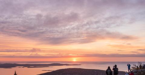 People watching the sunrise at Cadillac Mountain in Acadia National Park, Maine