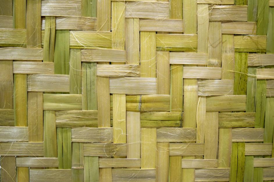 A stock photo of bamboo sheets weaved together. 