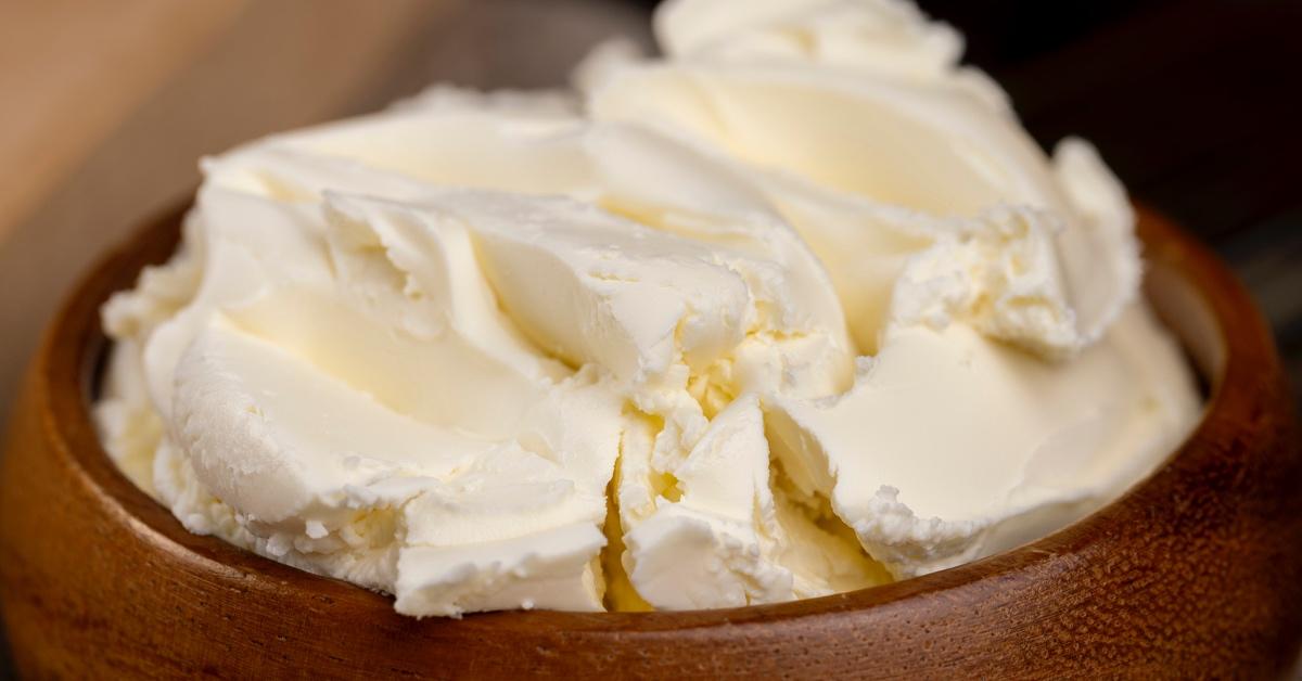 Cream cheese in a wooden bowl. 