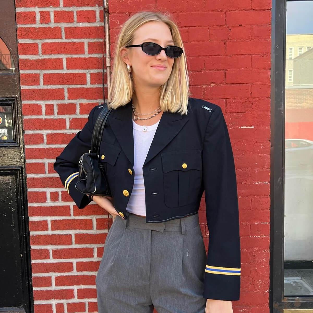 Photo of Maddie West — founder and designer of Sloppy Seconds — wearing a vintage U.S. army cropped blazer 