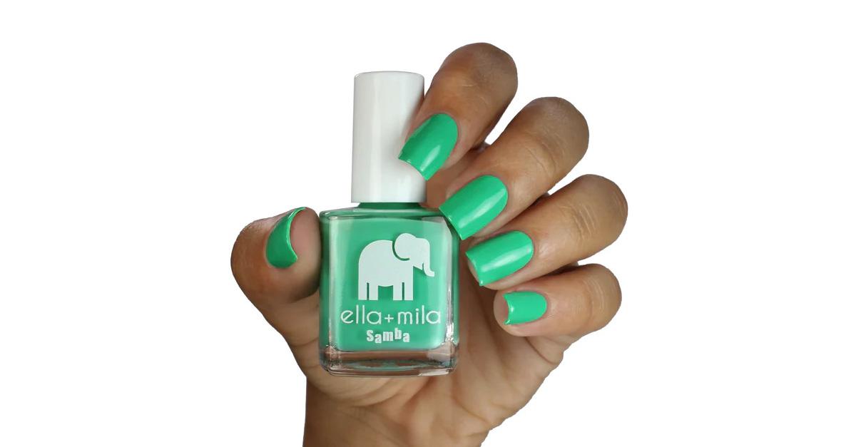 green nail polish by ella + mila in someone's hand