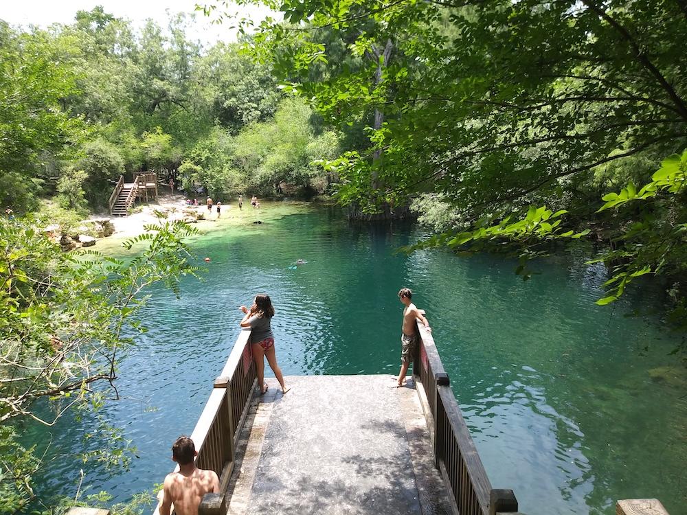 Kids jumping off a swim platform at a freshwater spring on the Suwannee River