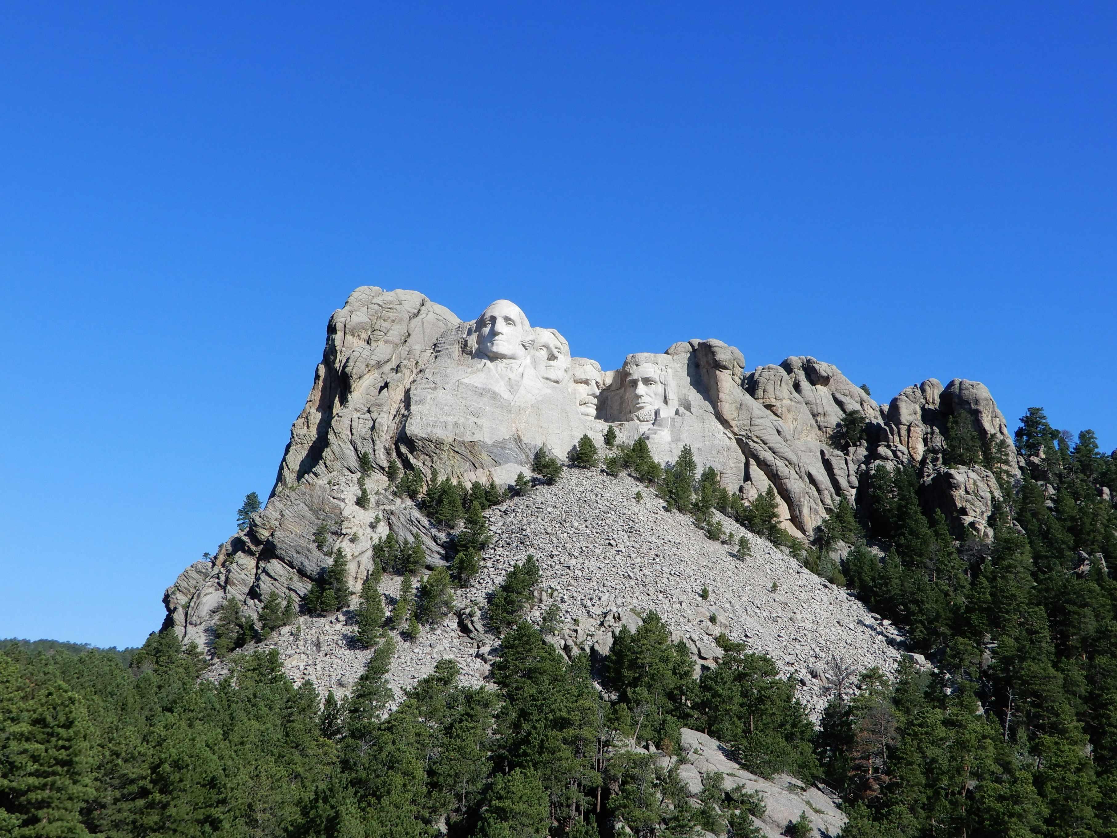 Mount Rushmore is pictured on a bright, sunny day.
