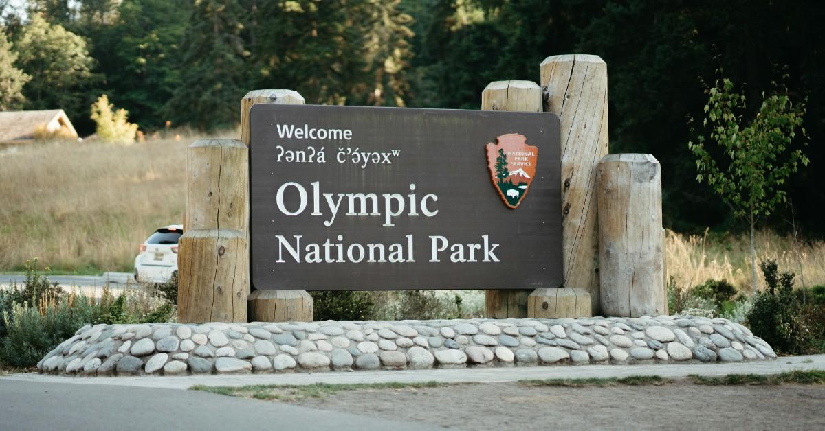 The welcome sign for Olympic National Park sits at the entrance to the park