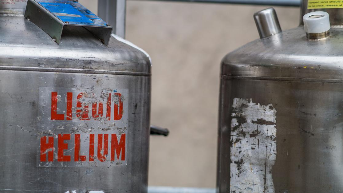 A close-up of two Dewar jars of liquid helium.