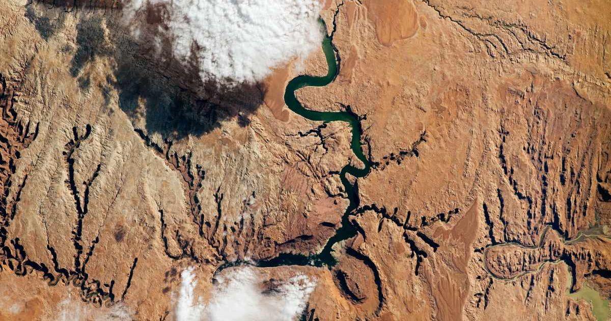 The Colorado River supplies water to more than 40 million people as it snakes through seven U.S. states, including the part of southeastern Utah seen in this photo snapped by an astronaut aboard the International Space Station. (Cover Image Source: NASA)