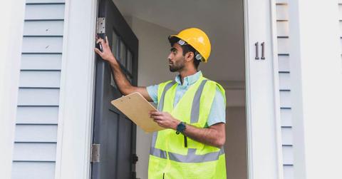 A handyman checking the door hinge. (Representative Cover Image Source: Pexels | RDNE Stock project)