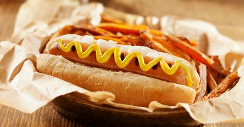 Photograph of a vegan hot dog with mustard.