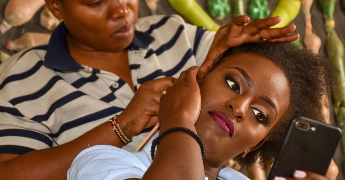 A Black woman gets her hair done
