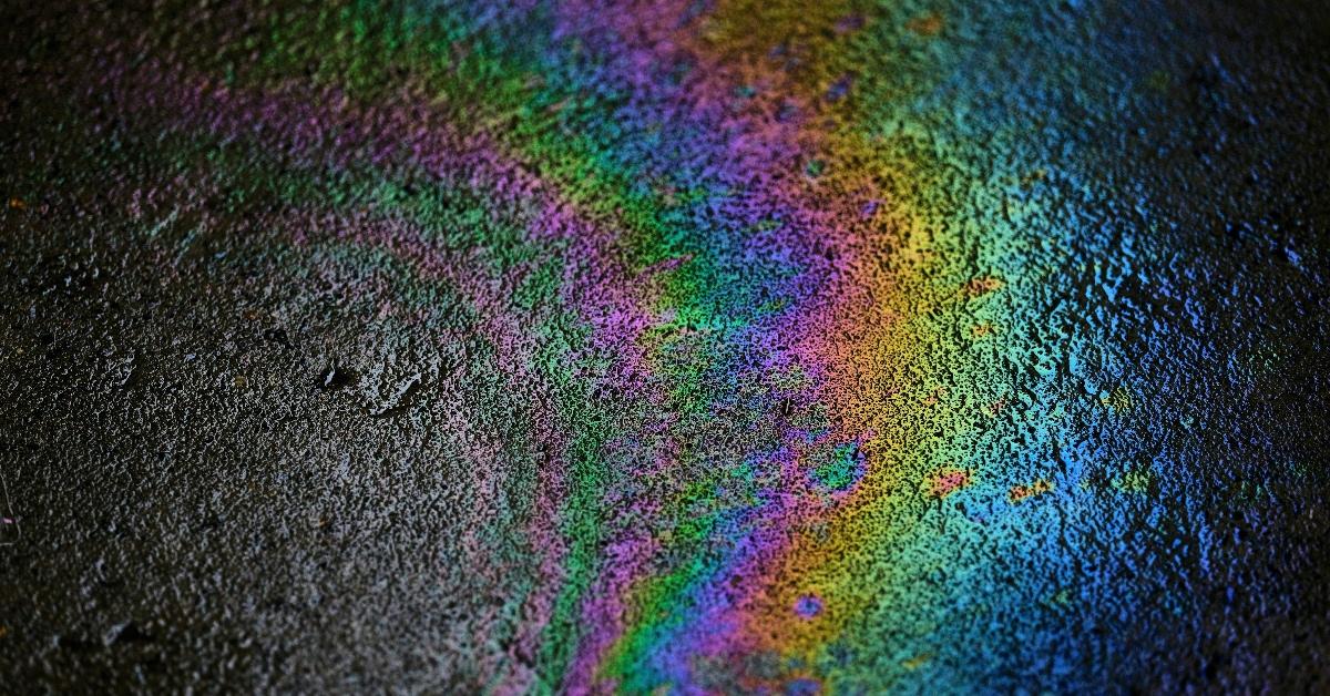 Rainbow oil patch on a stretch of tarmac.