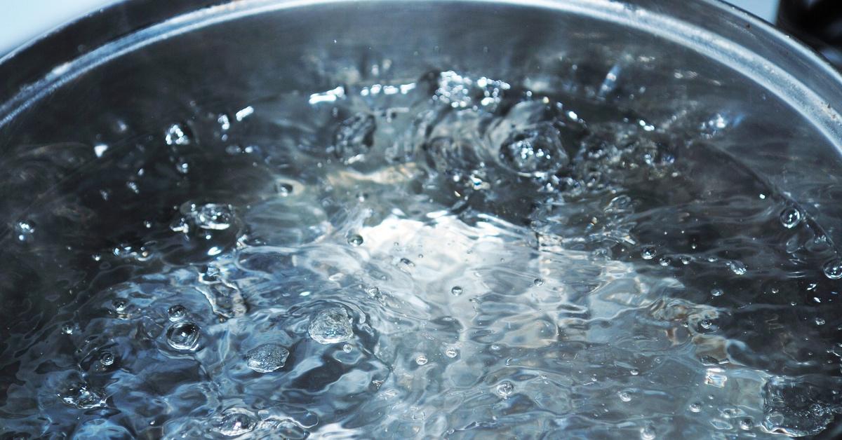 Close-up photo of boiling water on a stove. 