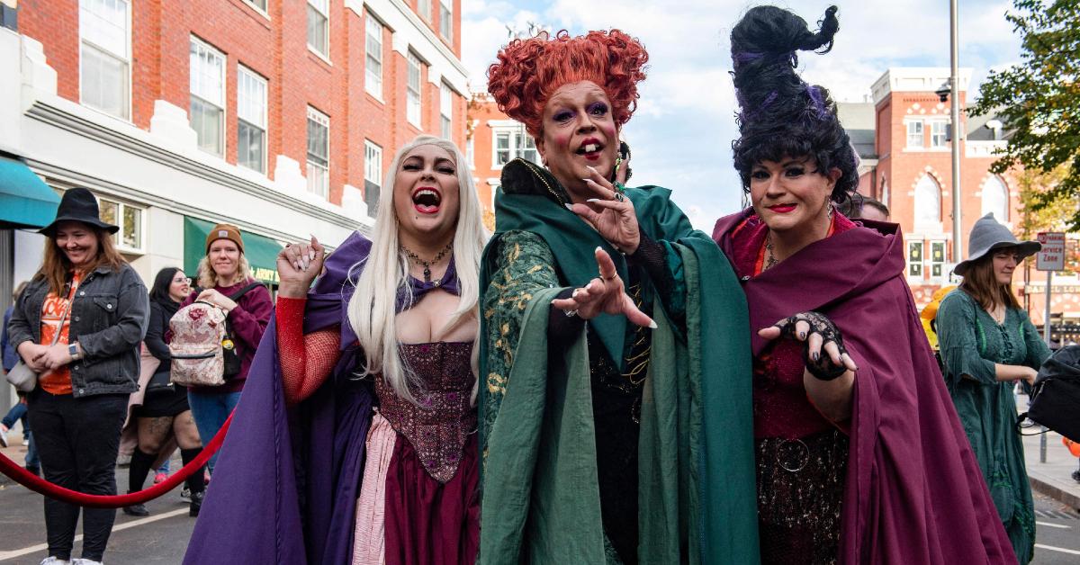 Salem, Mass., visitors dressed as the Sanderson sisters from 1993's 'Hocus Pocus" pose on Halloween in Salem