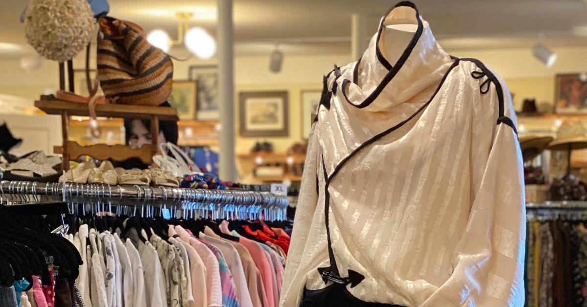 A blouse on display in a clothing store.