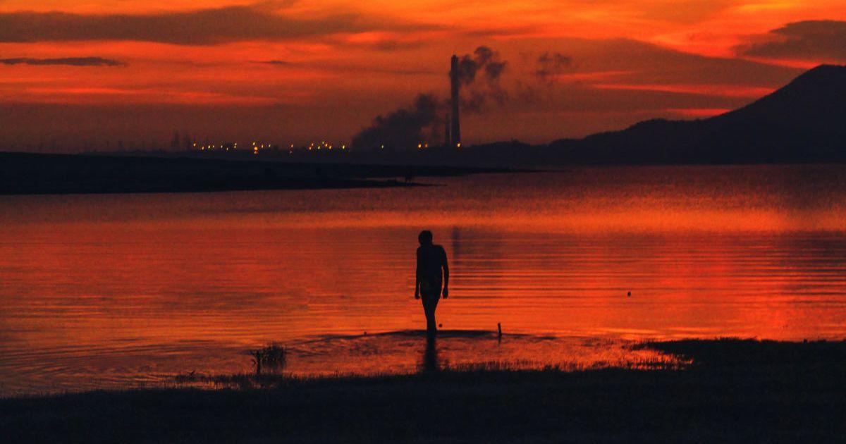 Waterbody with toxic orange hues. (Representative Cover Image Source: Pexels | Photo by Subhro)