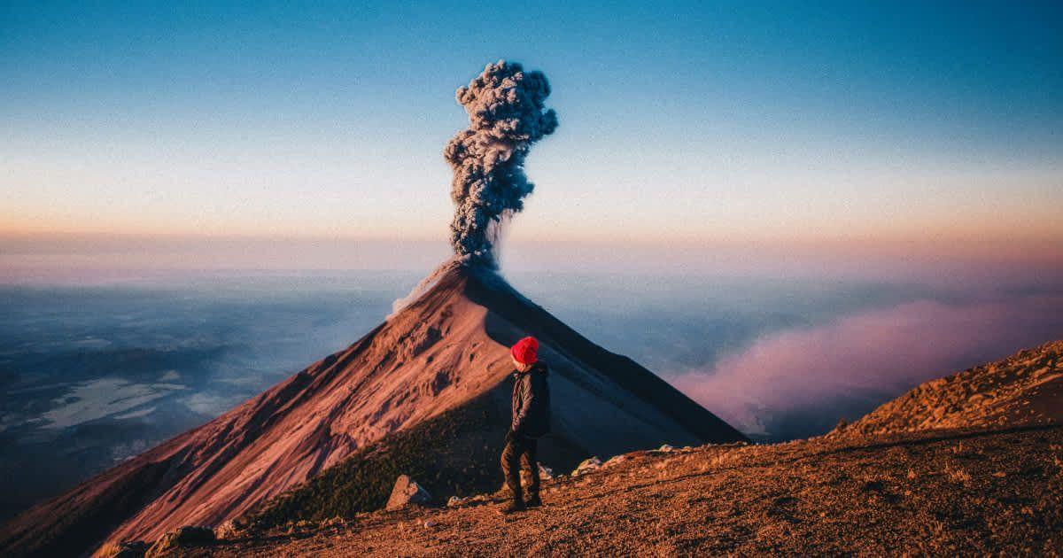 A man looking at a volcano. (Representative Cover Image Source: Getty Images | EyeEM Mobile GmbH)