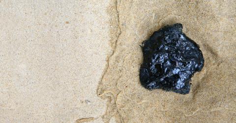 Tar ball on the beach.