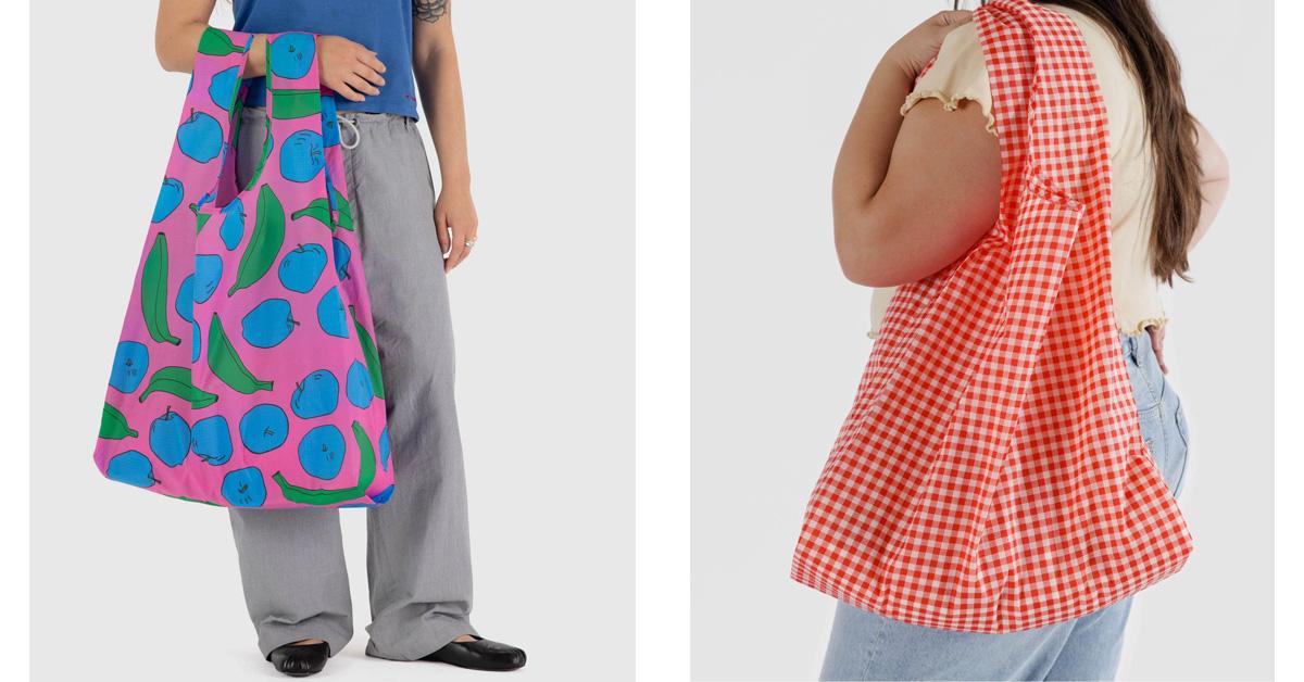 two people holding two reusable grocery bags with fruit pattern and gingham pattern