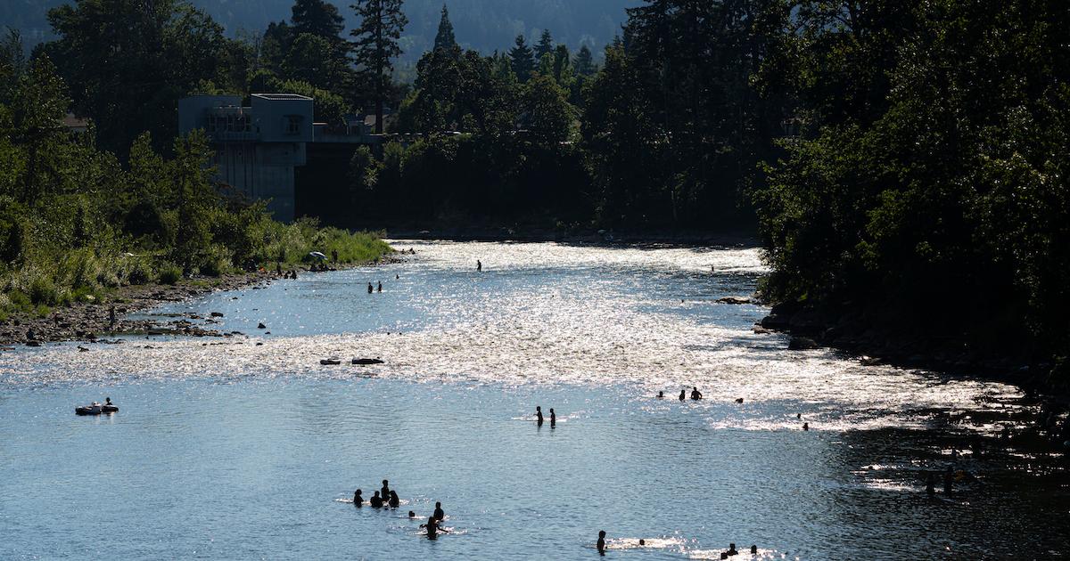 People cooling off in a river