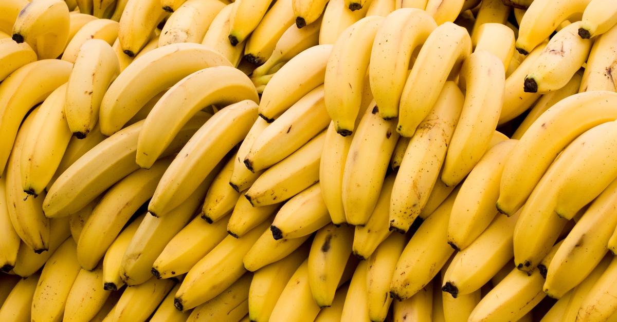 Bananas sitting on the ground. 