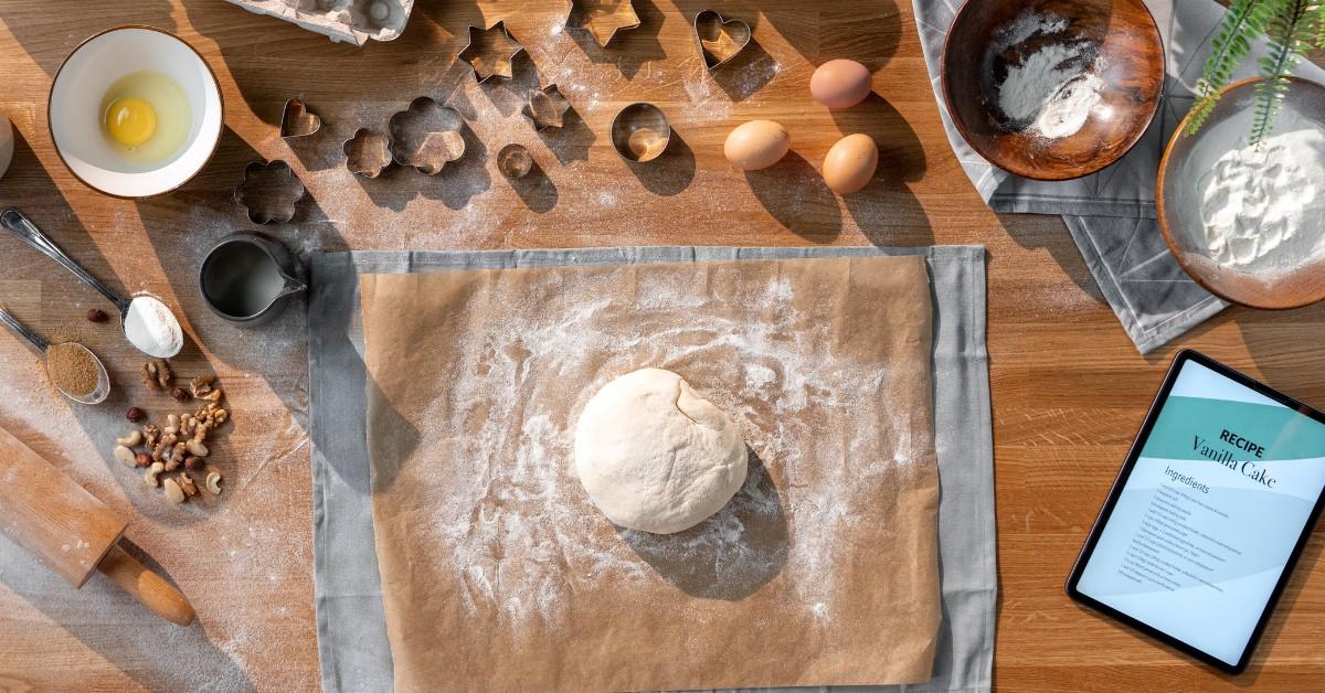 Overhead shot of cooking supplies, including parchment paper