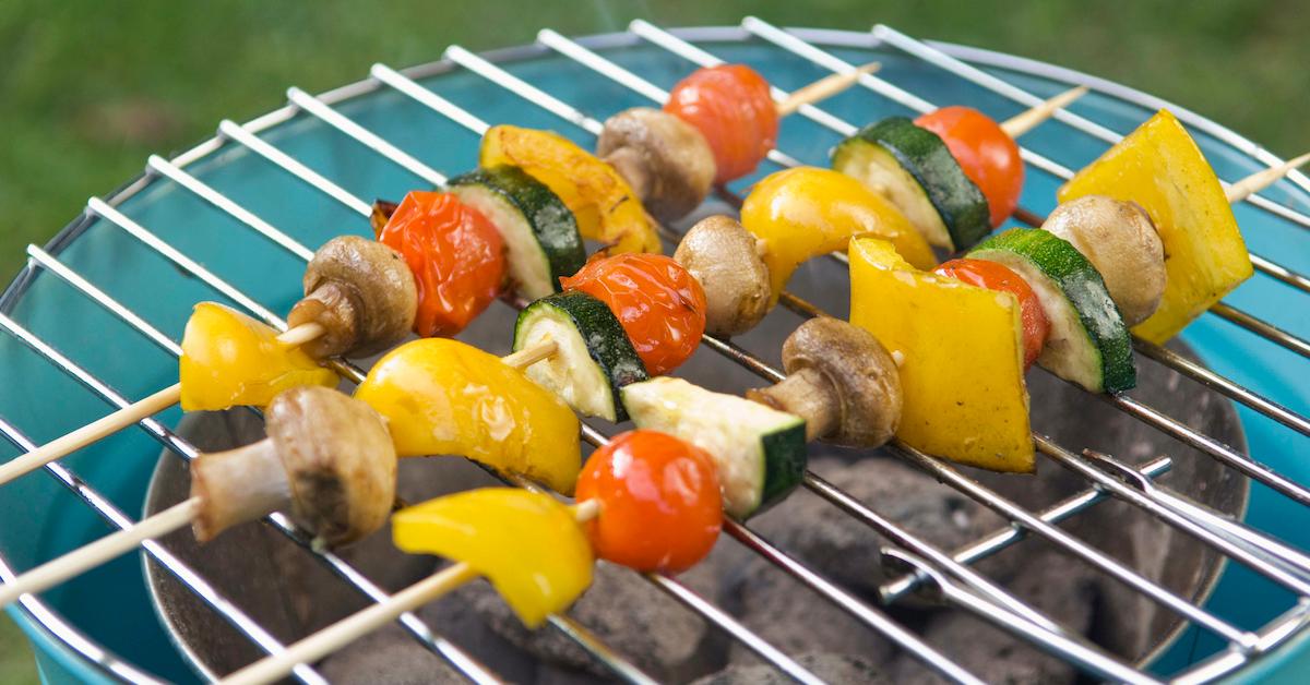 A veggie kabab on an outside grill. 