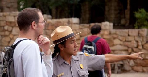 A park ranger is guiding a tourist at a national park. (Representative Cover Image Source: Getty Images | mattjeacock)