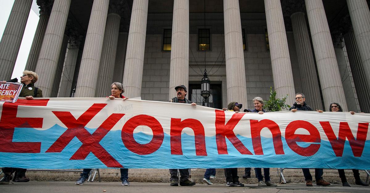 Protesters hold "Exxon knew" banner