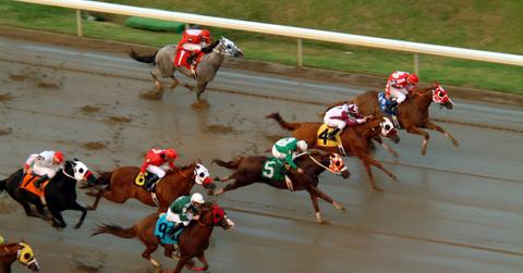 An aerial shot of jockeys riding horses.