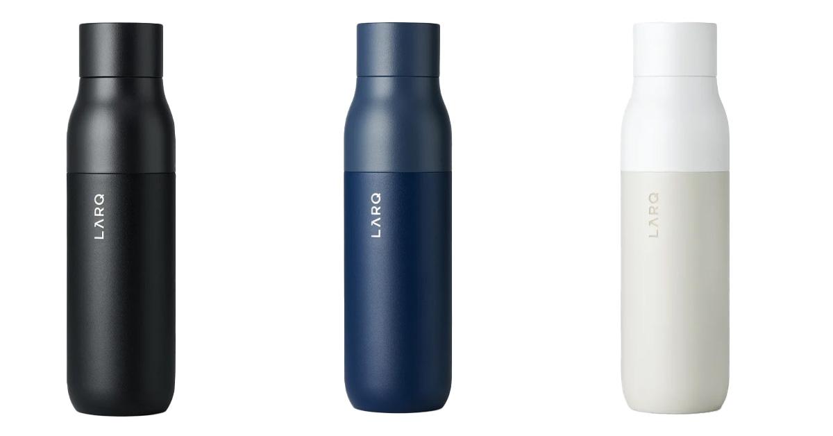 Three reusable water bottles in black, navy blue, and off white 