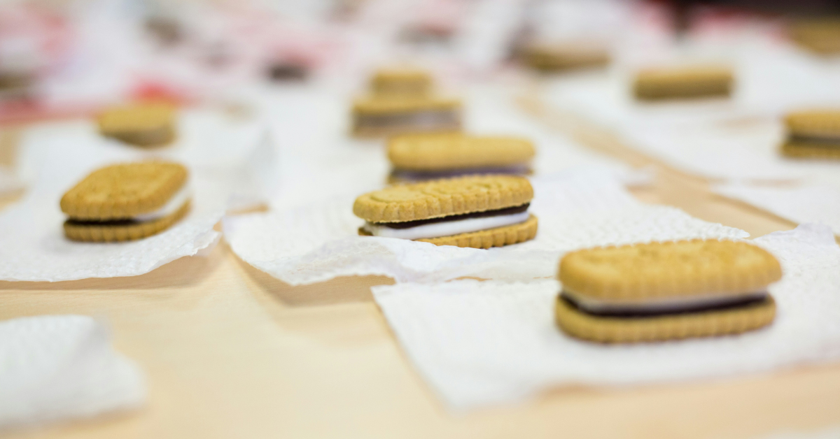 Individual s'more Girl Scout Cookies are placed on napkins on a table