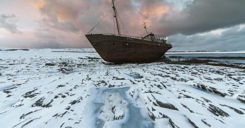 Ship wreck lays abandoned in a field of ice (Representative Cover Image Source: Pexels | Yaroslav Shuraev)