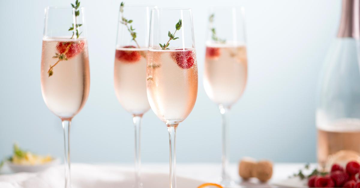 Pink cocktails in champagne glasses.