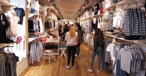 People standing inside a Brandy Melville store.