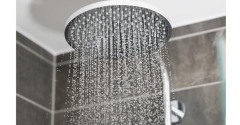 A shower head running water.