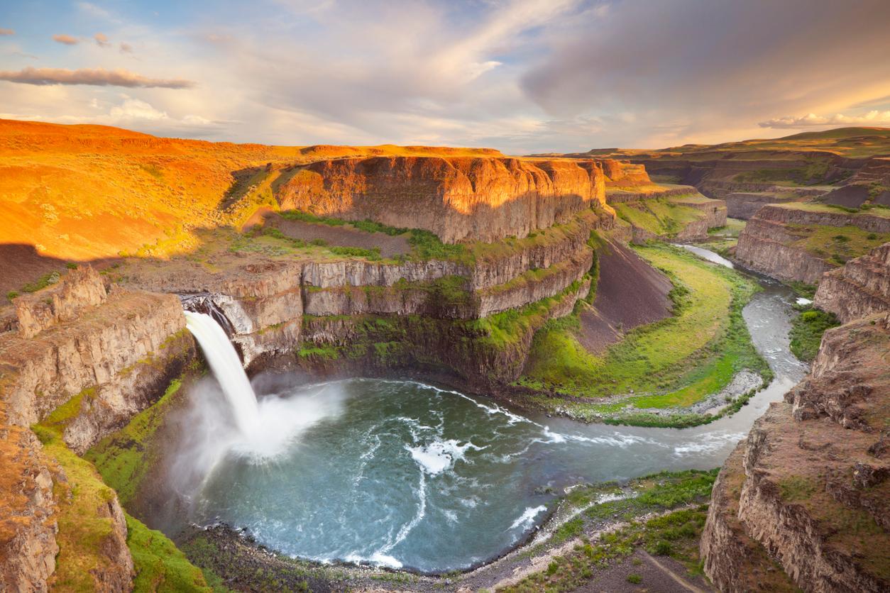 A landscape view of a waterfall at Palouse Falls State Park in Washington.